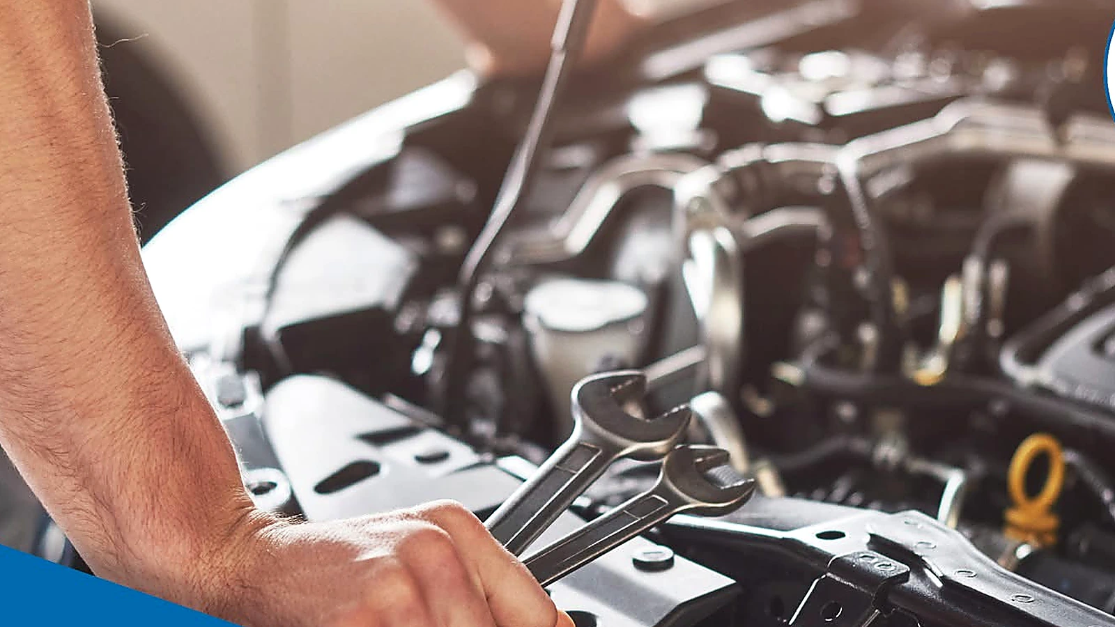 Technician performing routine under-hood maintenance